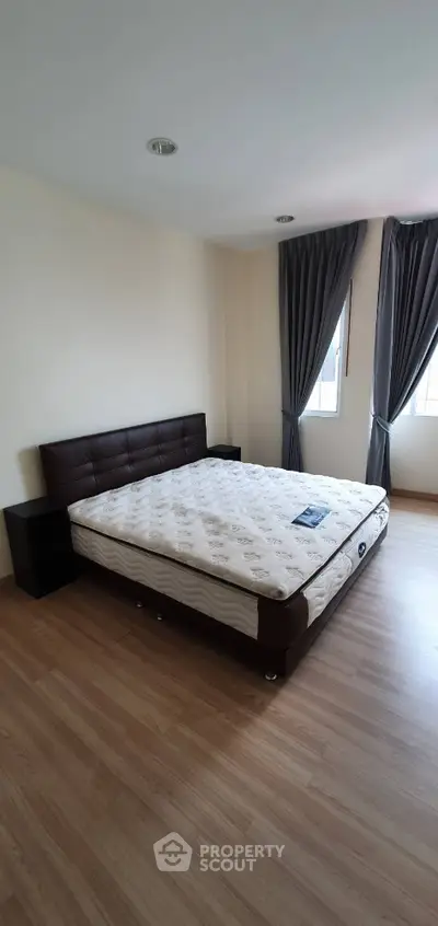 Spacious bedroom with modern design and natural light