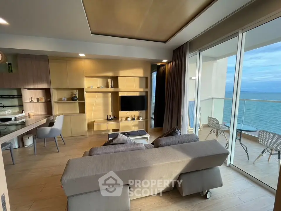Luxurious beachfront living room with stunning ocean view and modern open layout.