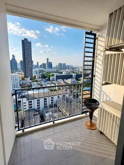 Stunning city view from modern balcony with sleek design and ample space.