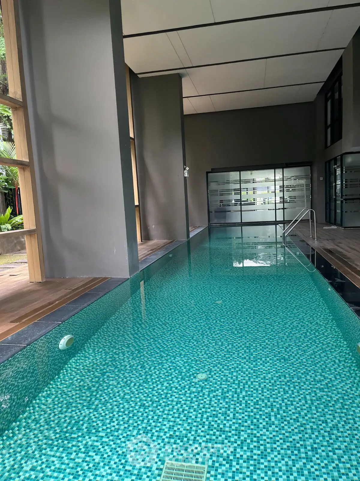 Luxurious indoor swimming pool with modern design and serene ambiance