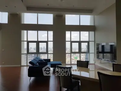 Spacious living room with stunning city view and modern furniture