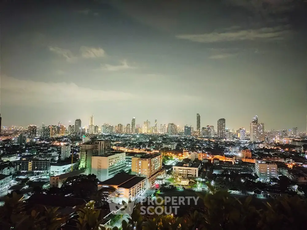 Stunning city skyline view at night with illuminated buildings and vibrant urban landscape.