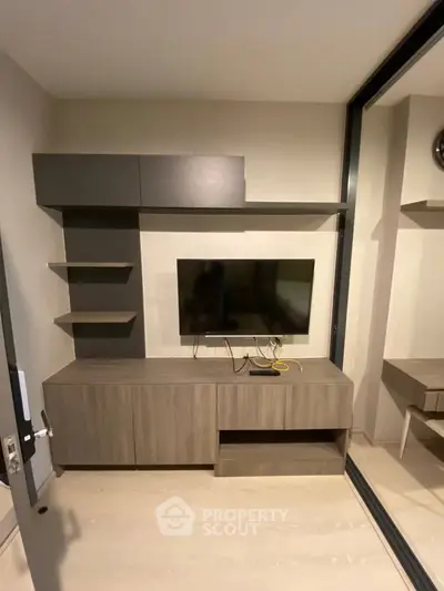 Modern living room with sleek TV unit and stylish shelving