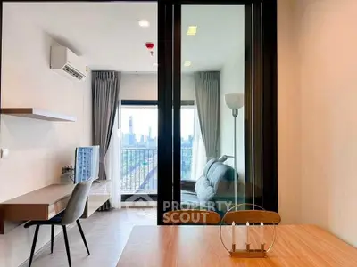 Modern apartment with city view, featuring a cozy living area and stylish workspace.