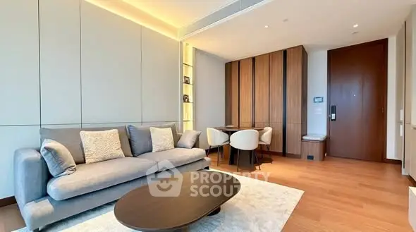 Modern living room with elegant furniture and wooden flooring in a luxury apartment.