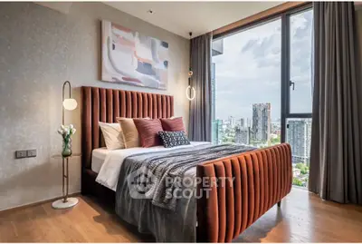 Luxurious bedroom with stunning city view and modern decor