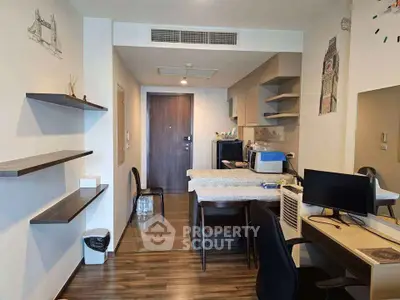 Modern apartment interior with stylish decor and open layout, featuring a cozy workspace and dining area.