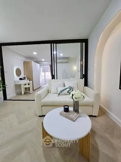 Modern living room with cozy sofa and stylish decor