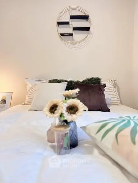 Cozy bedroom with stylish decor and plush pillows