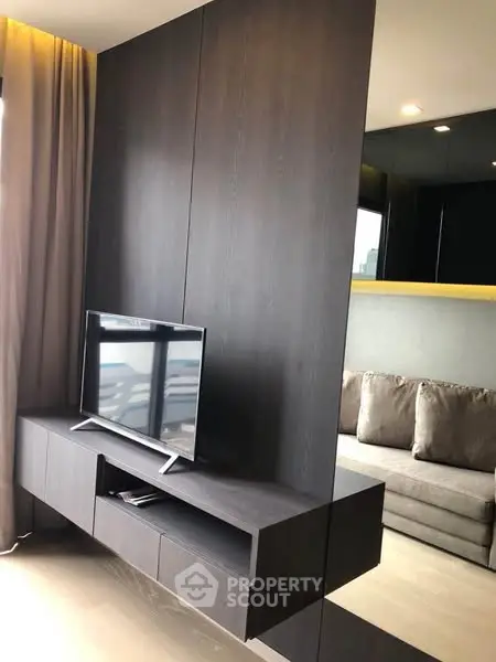 Modern living room with sleek TV stand and cozy sofa