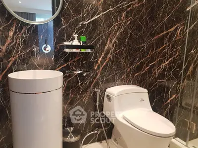 Luxurious bathroom with elegant marble walls and modern fixtures
