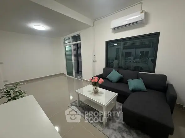 Modern living room with sleek design and cozy seating area