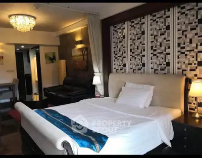 Luxurious bedroom with elegant decor and ambient lighting