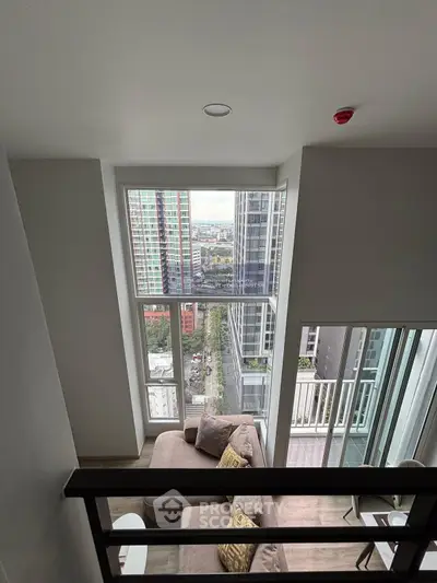 Modern high-rise condo with stunning city view and cozy living area