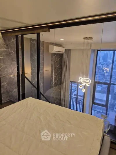 Luxurious bedroom with city view and modern lighting in high-rise apartment