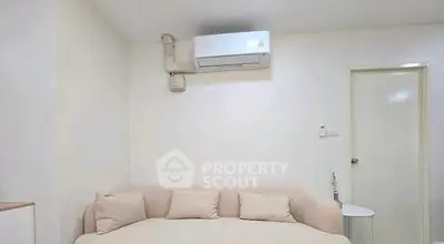 Cozy living room with modern air conditioning and plush sofa