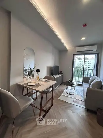 Modern living room with stylish decor and balcony view
