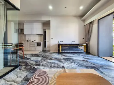 Modern open-plan living room with stylish kitchen and unique flooring