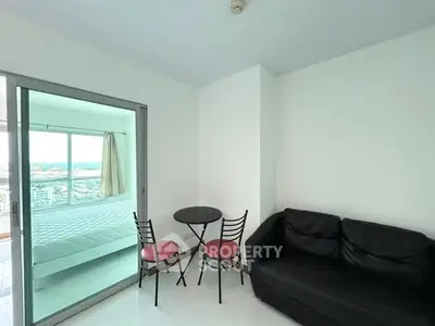 Modern apartment with cozy living area and bedroom view