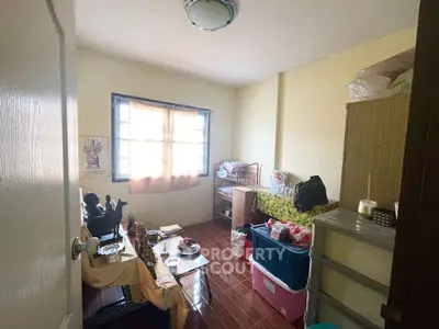 Cozy storage room with ample natural light and organized shelving