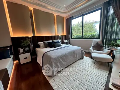 Luxurious bedroom with modern design and large window view