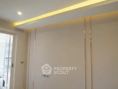 Modern interior with elegant lighting and sleek wall design in a contemporary apartment.