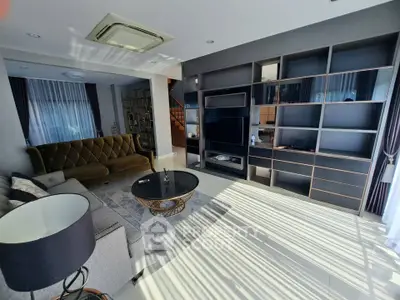 Luxurious living room with modern furniture and built-in shelving