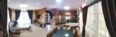 Spacious modern living room with elegant decor and large windows for natural light.