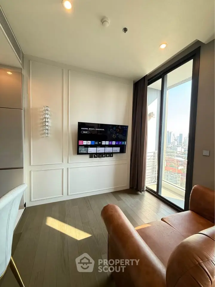 Modern living room with city view and wall-mounted TV in high-rise apartment