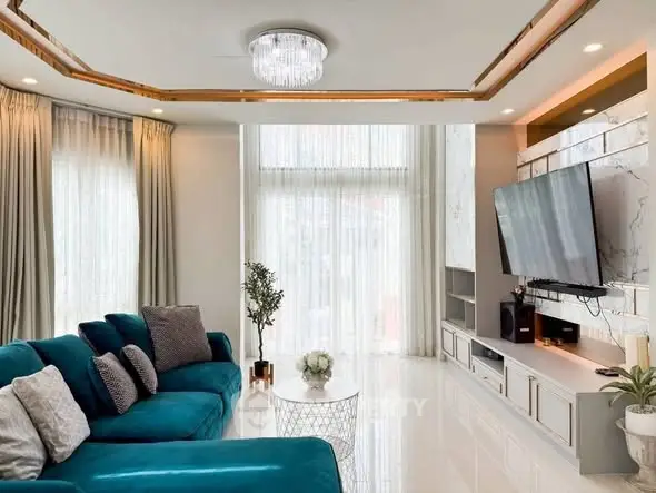 Luxurious living room with elegant teal sofa and modern decor