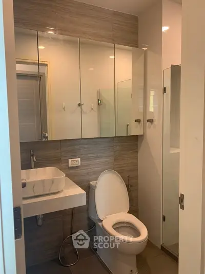 Modern bathroom with sleek fixtures and ample storage space