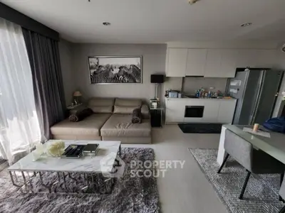 Modern living room with stylish decor and open kitchen layout