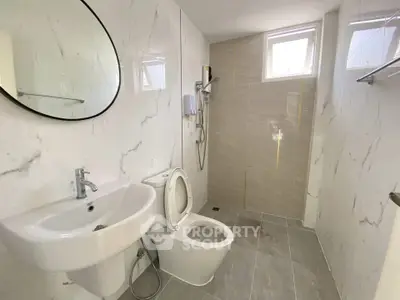 Modern bathroom with sleek fixtures and elegant marble tiles