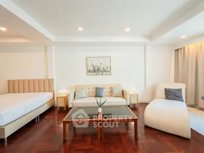 Spacious modern living room with elegant furniture and wooden flooring