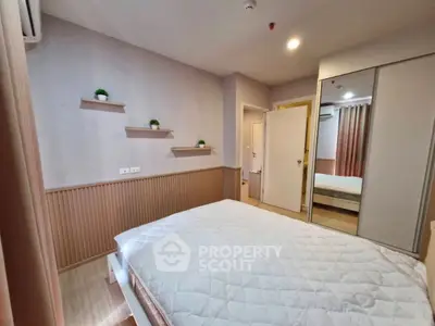 Cozy bedroom with modern decor and ample storage space