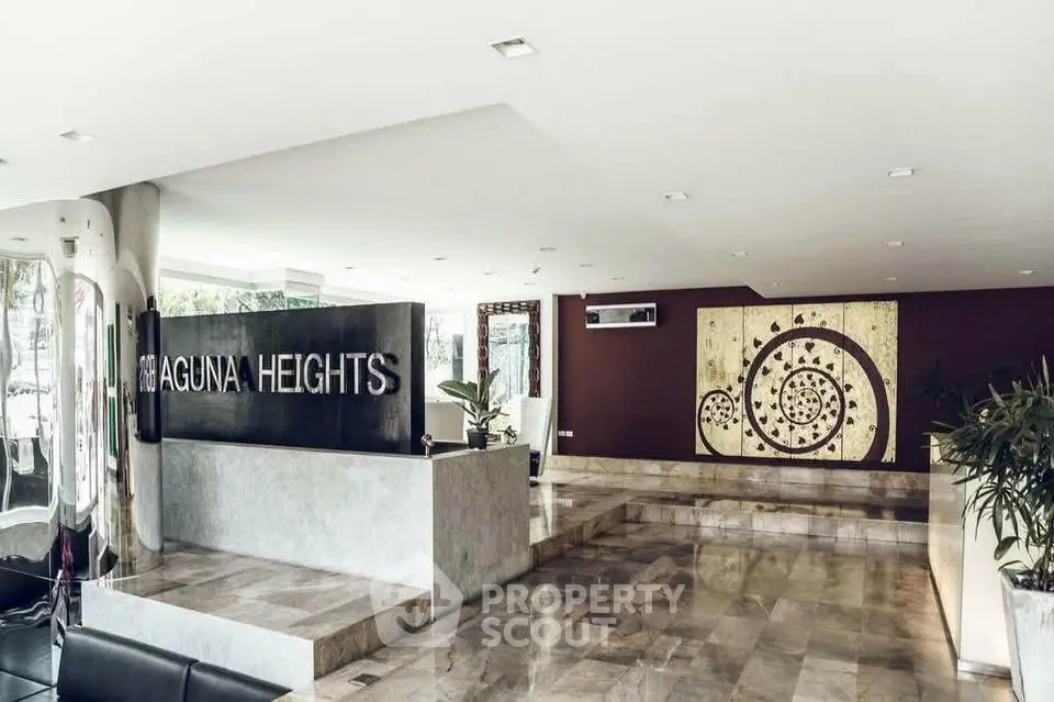 Elegant modern lobby with marble flooring and stylish decor at Laguna Heights