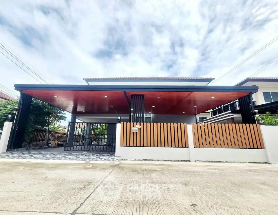 Modern single-story house with sleek design and spacious driveway