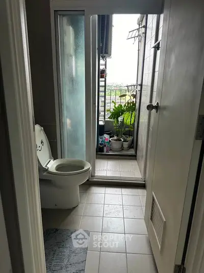 Cozy bathroom with balcony view and charming decor