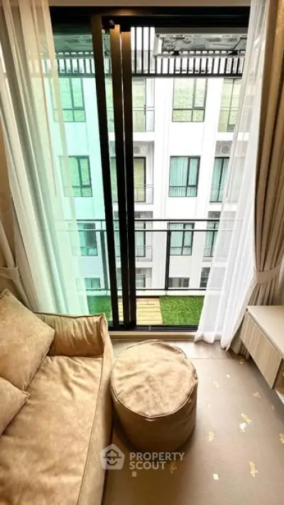 Modern living room with balcony view in stylish apartment
