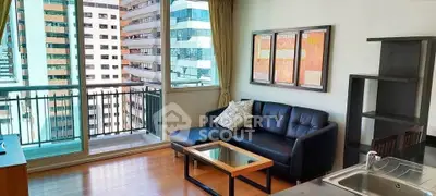 Modern living room with balcony view in high-rise apartment