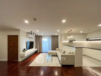 Spacious modern living room with open kitchen and elegant decor