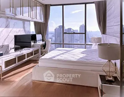 Luxurious bedroom with stunning city view, featuring modern decor and large windows for natural light.