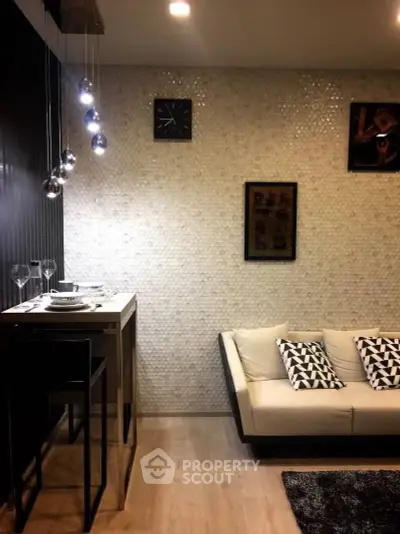 Stylish modern living room with textured wall and elegant lighting