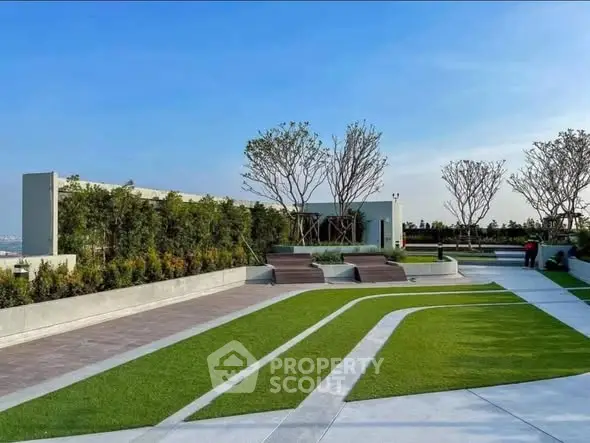 Stunning rooftop garden with modern landscaping and seating area