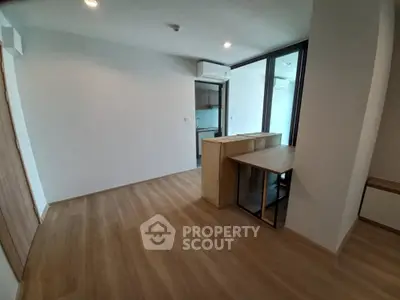 Modern apartment interior with open layout and wooden flooring