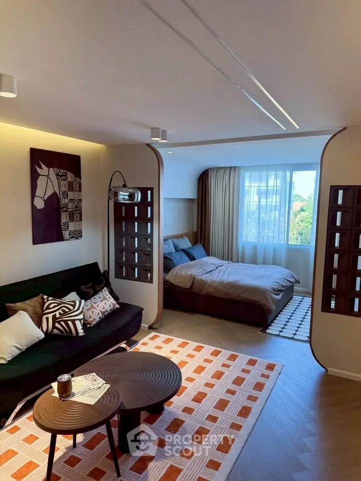 Stylish modern living room with cozy bedroom and chic decor