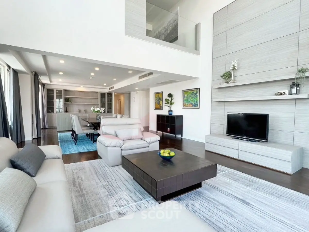 Spacious modern living room with high ceilings and elegant decor