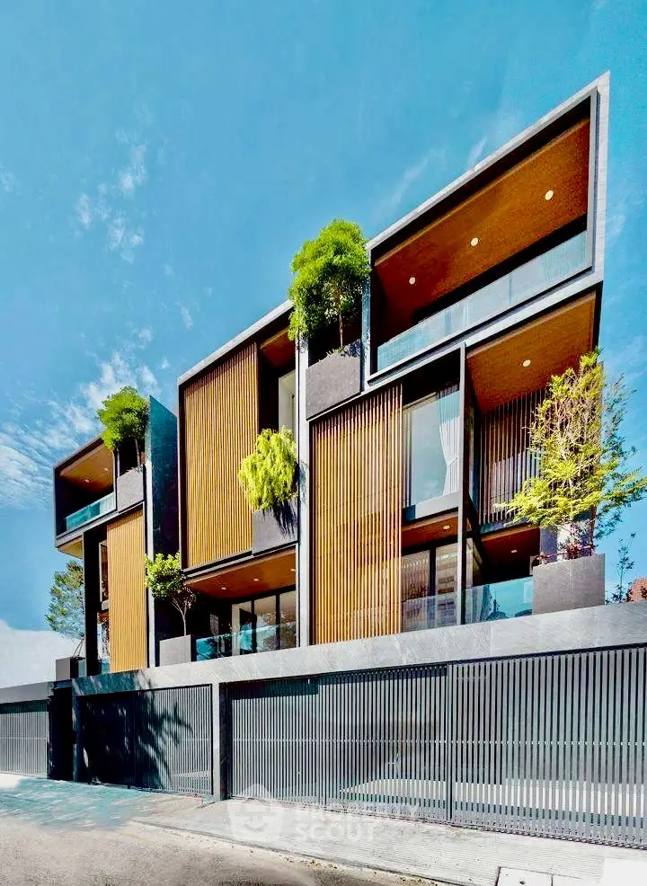 Modern architectural masterpiece with lush greenery and sleek design in urban setting.