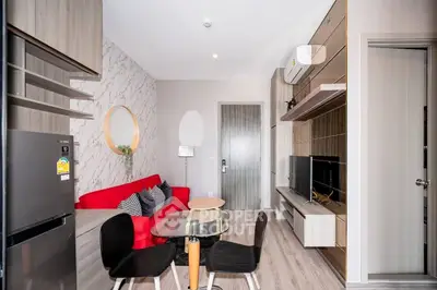 Modern living room with stylish decor, red sofa, and sleek entertainment center in a contemporary apartment.
