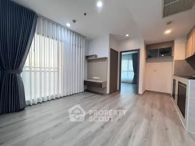 Modern apartment interior with open layout and stylish flooring